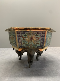 A pair of Chinese cloisonn&eacute; 'lotus and elephant' jardini&egrave;res, 18/19th C.