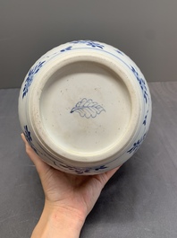 A Chinese blue and white jar with floral design and a wooden cover, Kangxi