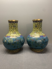 A pair of large Chinese cloisonn&eacute; 'magpies among flowering branches' vases, 19th C.