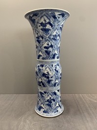 A Chinese blue and white 'landscape' 'gu' vase, Kangxi