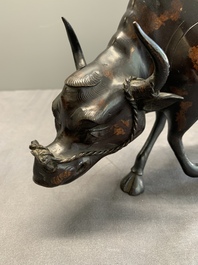 A Chinese gold-splashed bronze incense burner in the shape of an immortal riding a buffalo, 19th C.