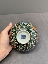 A Chinese black-ground famille rose 'flower scroll' bowl, Qianlong mark and of the period