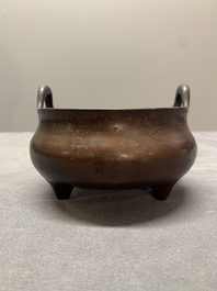 A Chinese bronze tripod censer, Xuande mark, Ming