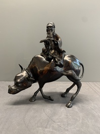 A Chinese gold-splashed bronze incense burner in the shape of an immortal riding a buffalo, 19th C.