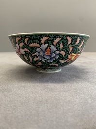 A Chinese black-ground famille rose 'flower scroll' bowl, Qianlong mark and of the period