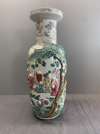 A pair of Chinese famille rose '18 luohan' vases with relief design, 19th C.
