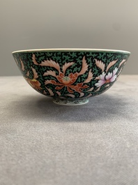 A Chinese black-ground famille rose 'flower scroll' bowl, Qianlong mark and of the period