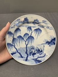 A pair of Chinese blue and white plates with a breastfeeding woman and fishermen on boats, Chenghua mark, Kangxi