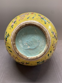 A large Chinese famille rose yellow-ground 'tianqiu ping' vase with flowers and antiquities, 19th C.