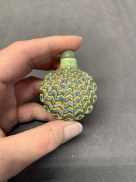 A Chinese blue and white 'dragon' snuff bottle and a polychrome 'peacock' snuff bottle, Yongzheng mark, 19/20th C.