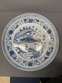 A large Chinese blue, white and copper-red 'carp' dish, 19/20th C.