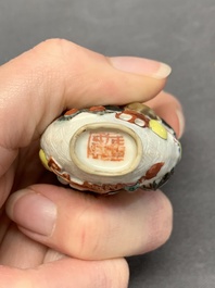 A Chinese molded famille rose 'antiquities' snuff bottle and porcelain stopper, Qianlong mark, 19th C.
