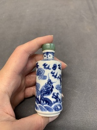 A Chinese blue and white 'dragon' snuff bottle and a polychrome 'peacock' snuff bottle, Yongzheng mark, 19/20th C.