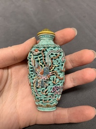 A Chinese moulded turquoise-ground famille rose 'dragon and phoenix' snuff bottle, 19th C.
