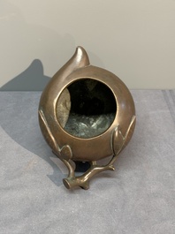 A Chinese bronze camel-form paperweight and a peach-shaped covered censer, 19th C.