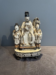 A rare Chinese Cizhou group with a dignitary, two attendants and a horse, Ming