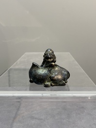 A Chinese bronze camel-form paperweight and a peach-shaped covered censer, 19th C.