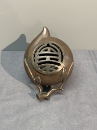 A Chinese bronze camel-form paperweight and a peach-shaped covered censer, 19th C.