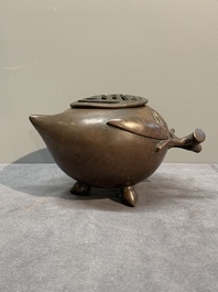 A Chinese bronze camel-form paperweight and a peach-shaped covered censer, 19th C.