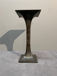 A Chinese archaistic bronze 'gu' vase and a 'hu' vase with rams in relief on a wooden stand, 18/19th C.
