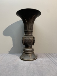 A Chinese archaistic bronze 'gu' vase with relief design, Ming