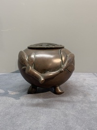 A Chinese bronze camel-form paperweight and a peach-shaped covered censer, 19th C.