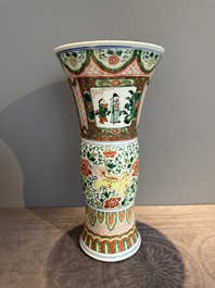 A Chinese wucai 'gu' vase with Buddhist lions, peony scrolls and figures, 19th C.