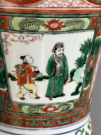 A Chinese wucai 'gu' vase with Buddhist lions, peony scrolls and figures, 19th C.