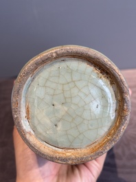 A Chinese Longquan celadon cylindrical vase with incised floral design, Ming