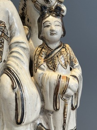 A rare Chinese Cizhou group with a dignitary, two attendants and a horse, Ming