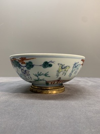 A Chinese doucai 'deer' bowl with gilt bronze stand, Chenghua mark, 18th C.