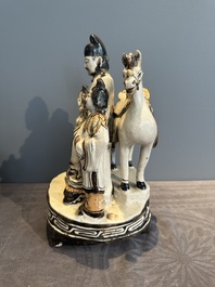 A rare Chinese Cizhou group with a dignitary, two attendants and a horse, Ming