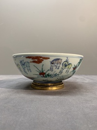 A Chinese doucai 'deer' bowl with gilt bronze stand, Chenghua mark, 18th C.