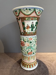 A Chinese wucai 'gu' vase with Buddhist lions, peony scrolls and figures, 19th C.
