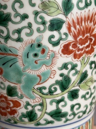 A Chinese wucai 'gu' vase with Buddhist lions, peony scrolls and figures, 19th C.