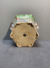 A Chinese Canton famille rose hexagonal jardini&egrave;re and stand with narrative design, 19th C.