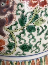 A Chinese wucai 'gu' vase with Buddhist lions, peony scrolls and figures, 19th C.