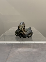A Chinese bronze camel-form paperweight and a peach-shaped covered censer, 19th C.