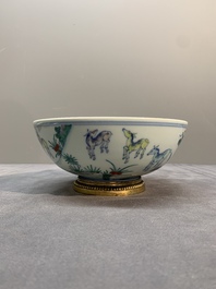 A Chinese doucai 'deer' bowl with gilt bronze stand, Chenghua mark, 18th C.