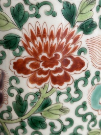 A Chinese wucai 'gu' vase with Buddhist lions, peony scrolls and figures, 19th C.