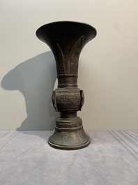 A Chinese archaistic bronze 'gu' vase with relief design, Ming