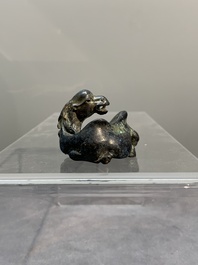 A Chinese bronze camel-form paperweight and a peach-shaped covered censer, 19th C.