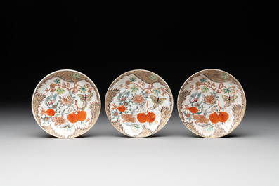 Three Chinese famille rose 'flowers and butterflies' cups and saucers, Yongzheng