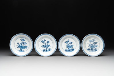 Five Chinese caf&eacute;-au-lait-ground blue and white cups and four saucers, conical shell mark, Kangxi