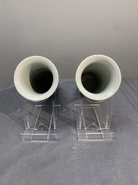 A pair of Chinese blue and white 'gu' vases, three jars, a plate and a plaque, Kangxi mark, 19th C.