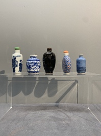 Five Chinese blue and white, iron-red and mirror-black-glazed snuff bottles, Qianlong mark, 19th C.