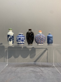 Five Chinese blue and white, iron-red and mirror-black-glazed snuff bottles, Qianlong mark, 19th C.