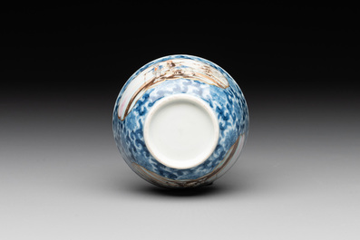 A Chinese export famille rose cup and saucer with a herring merchant, Qianlong