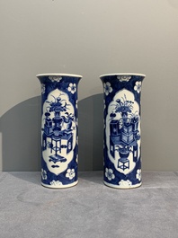 A pair of Chinese blue and white 'gu' vases, three jars, a plate and a plaque, Kangxi mark, 19th C.