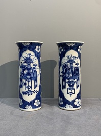 A pair of Chinese blue and white 'gu' vases, three jars, a plate and a plaque, Kangxi mark, 19th C.